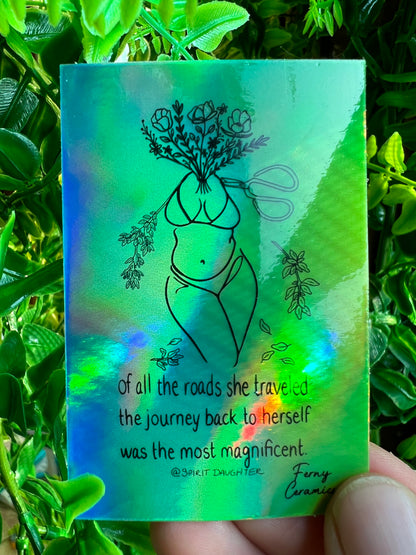 A Ferny Ceramics 2x3 Rectangular Holographic Sticker with a woman holding a flower in her hand featuring a protective lamination.